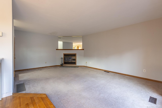 unfurnished living room with carpet flooring