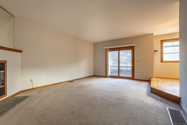 unfurnished living room with carpet flooring