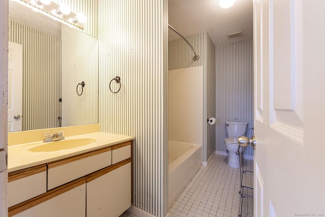 full bathroom featuring vanity, tile patterned floors, toilet, a textured ceiling, and shower / bathtub combination