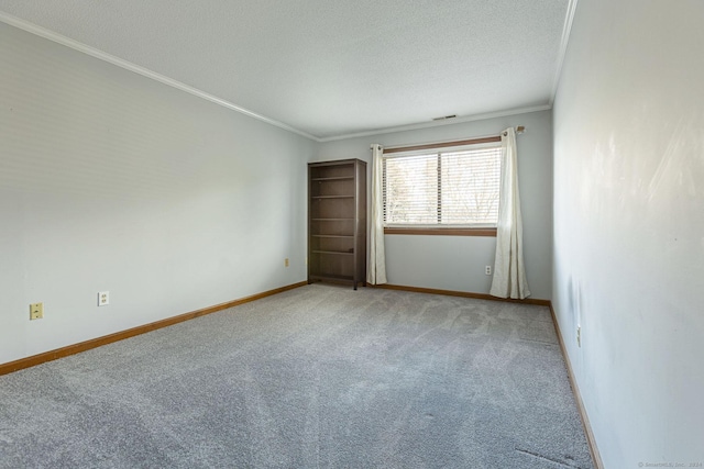 unfurnished room with carpet flooring, crown molding, and a textured ceiling