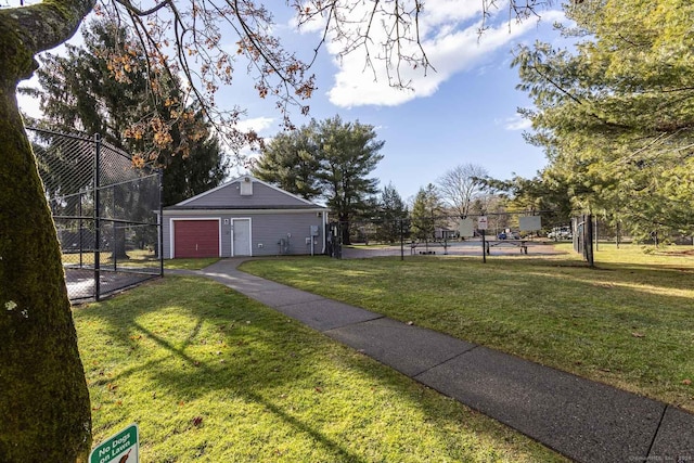 view of yard featuring an outbuilding and a garage