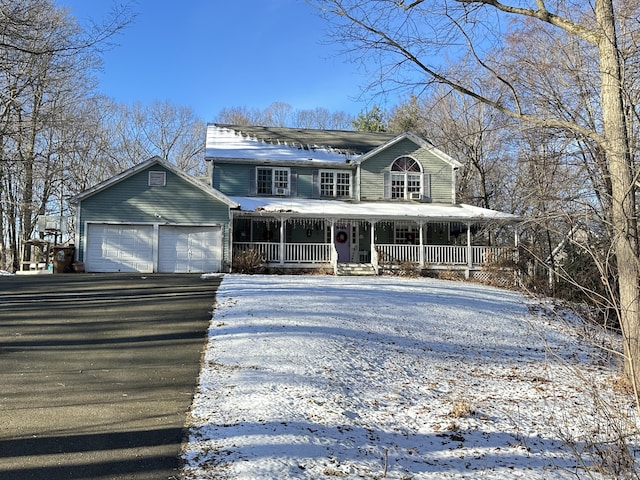 view of front facade with a porch and a garage