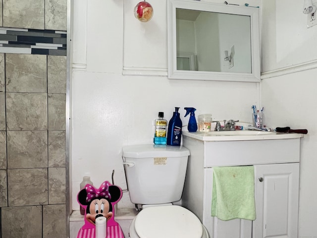 bathroom featuring vanity and toilet