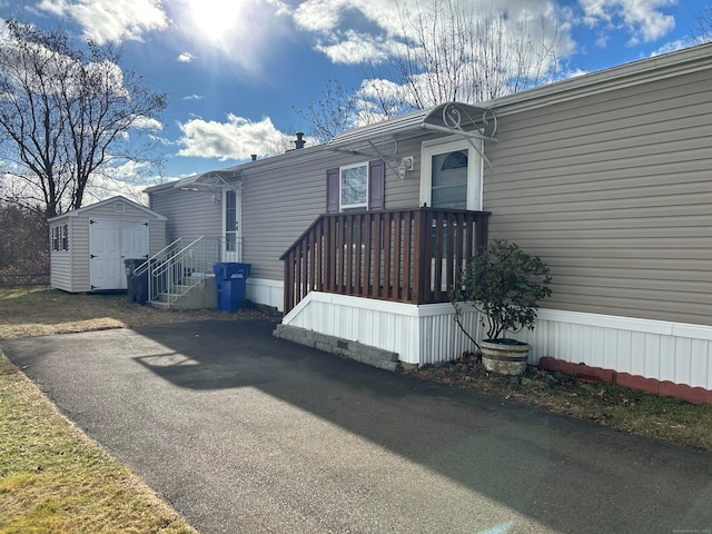 view of front of home with a storage unit