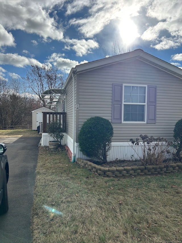 view of home's exterior featuring a yard