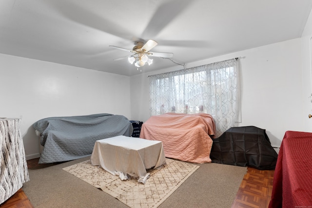 bedroom featuring dark parquet flooring and ceiling fan