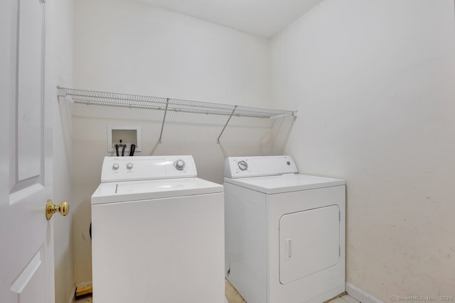 laundry room with washing machine and clothes dryer