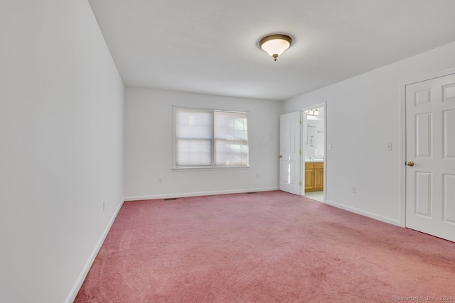 spare room featuring carpet floors