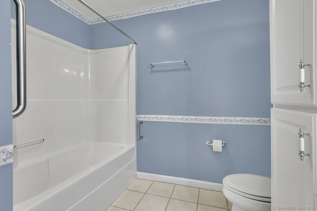 bathroom with tile patterned floors, toilet, and bathtub / shower combination