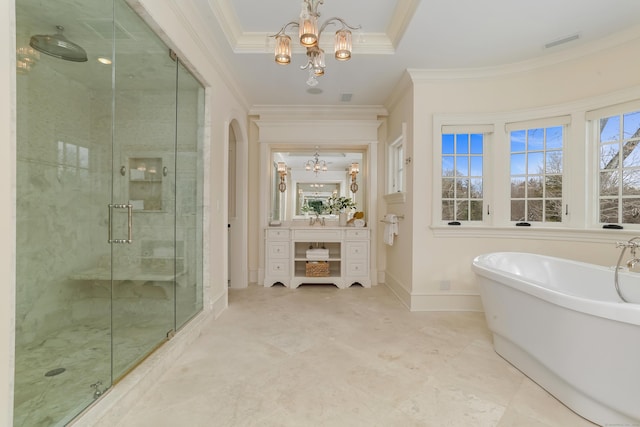 bathroom with ornamental molding, vanity, an inviting chandelier, and plus walk in shower