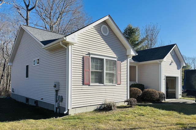 view of property exterior featuring a lawn