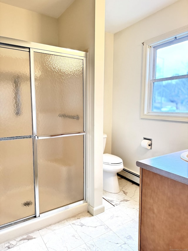 bathroom featuring vanity, toilet, a shower with shower door, and a baseboard heating unit