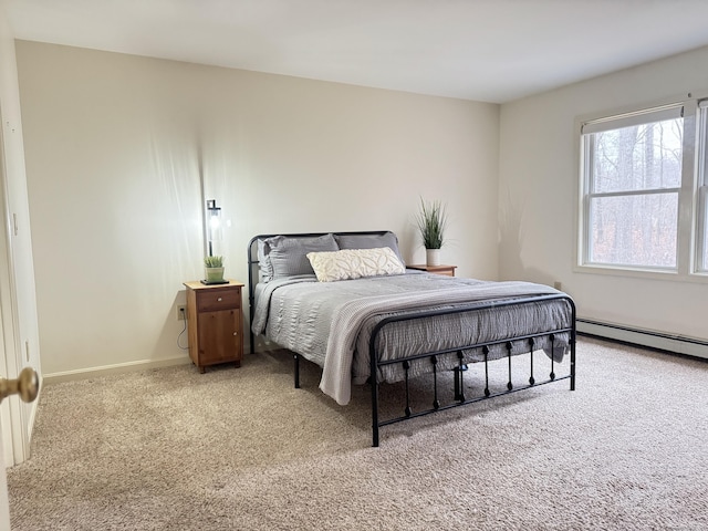 bedroom featuring carpet floors and a baseboard heating unit