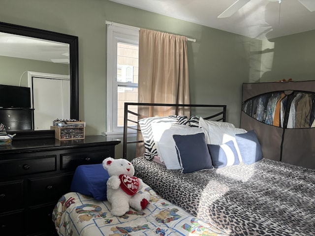 bedroom with multiple windows, a closet, and ceiling fan