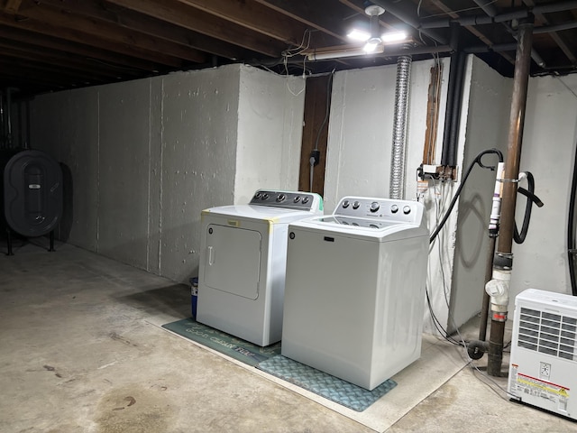 laundry area with washing machine and dryer