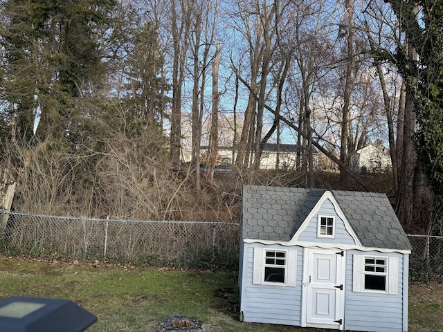 view of outbuilding featuring a lawn