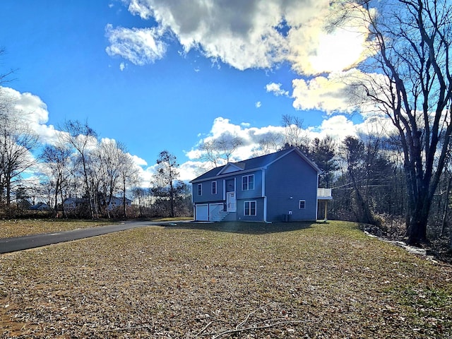 view of side of property featuring a garage