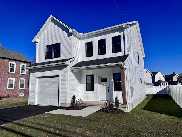 view of front facade with a garage and a front lawn