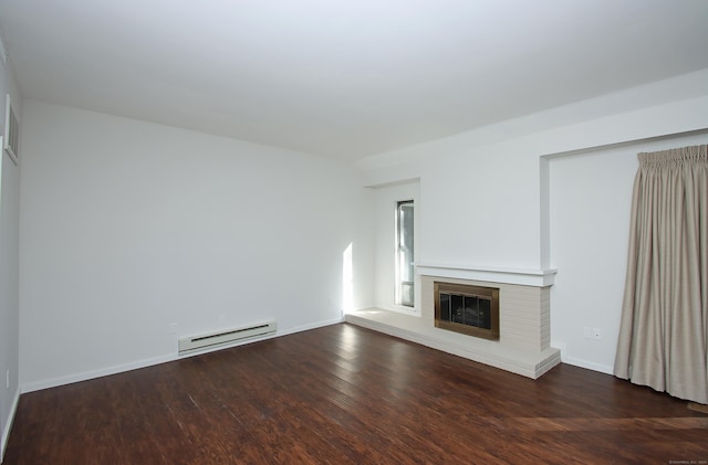 unfurnished living room with a fireplace, dark hardwood / wood-style flooring, and a baseboard radiator