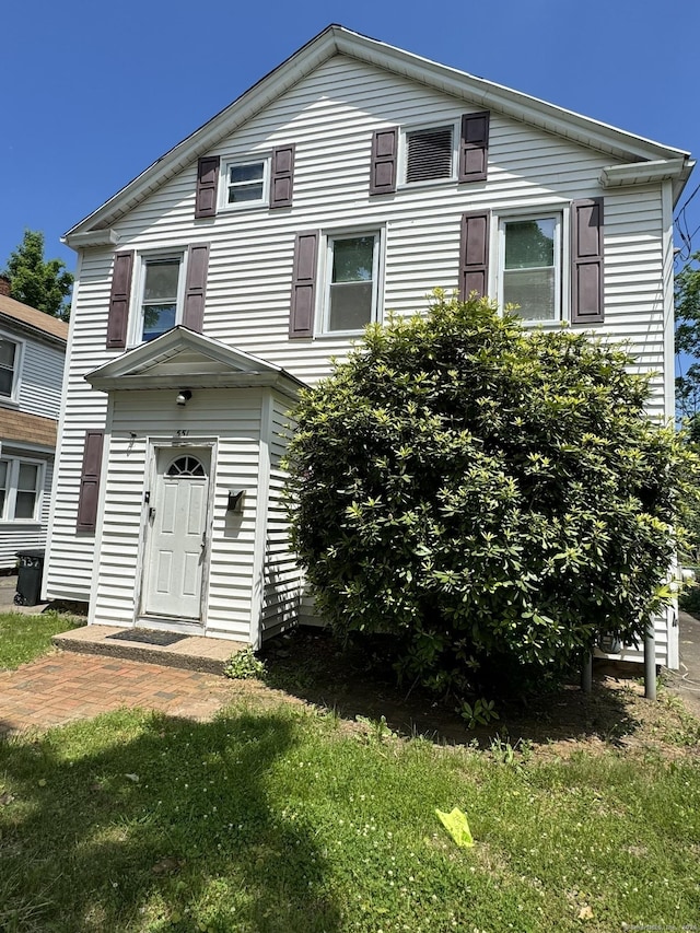 view of front of property with a front lawn