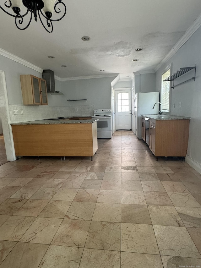 kitchen with an inviting chandelier, electric stove, sink, stainless steel dishwasher, and wall chimney exhaust hood