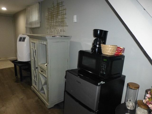 interior space with refrigerator and dark wood-type flooring