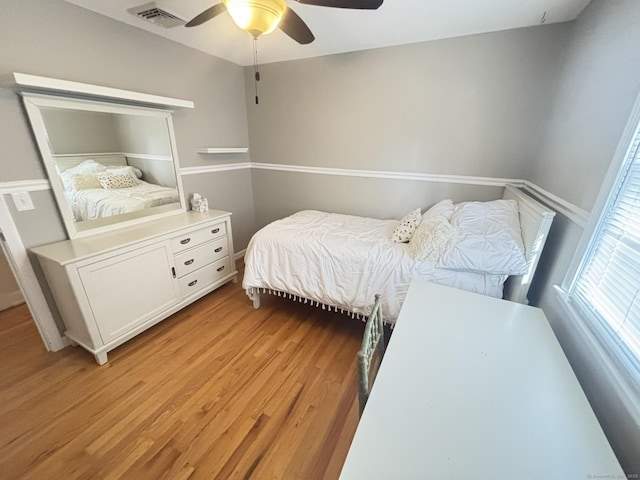 bedroom featuring ceiling fan and light hardwood / wood-style flooring