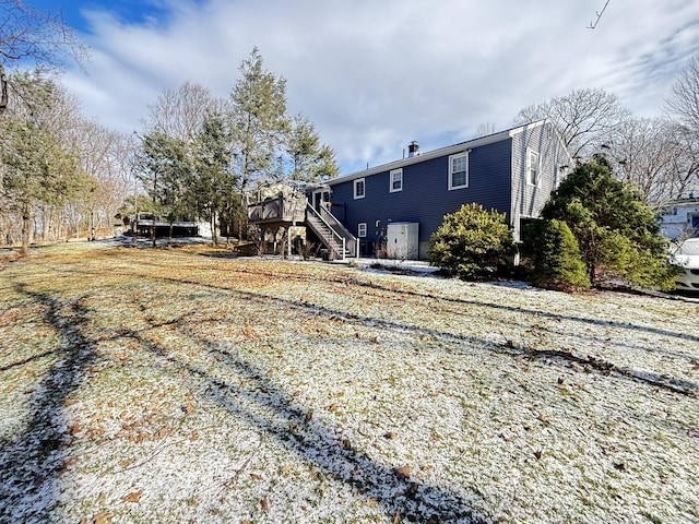 back of house featuring a wooden deck