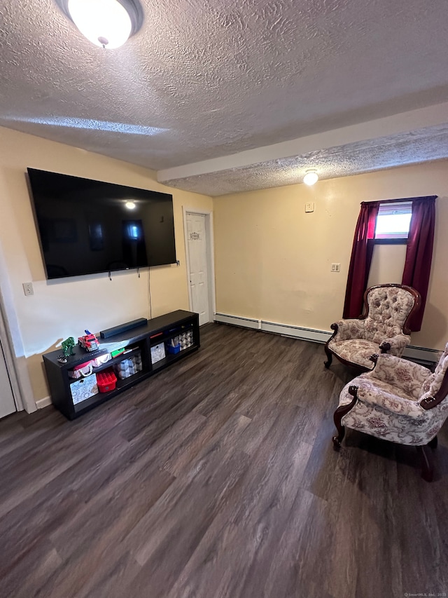 interior space featuring a textured ceiling, baseboard heating, and dark wood-type flooring