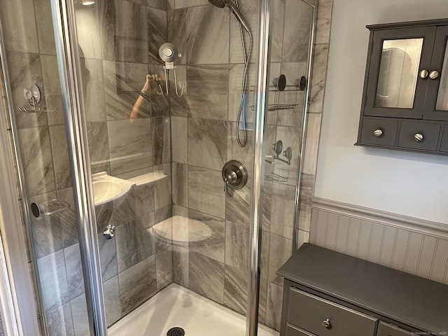 bathroom with a shower with shower door