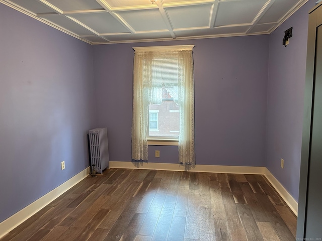 unfurnished room featuring radiator and dark wood-type flooring