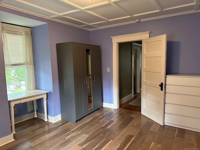 unfurnished bedroom with dark wood-type flooring