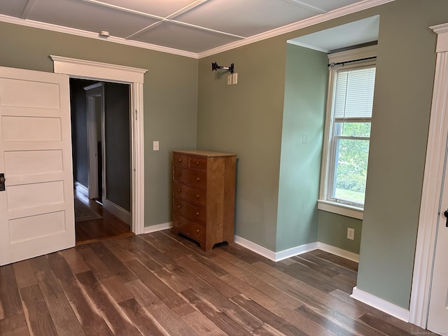 unfurnished bedroom with ornamental molding and dark hardwood / wood-style floors