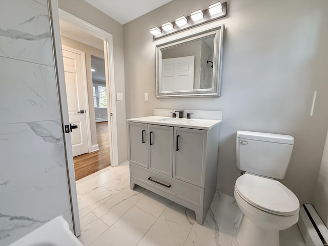 bathroom featuring a bathing tub, vanity, and toilet