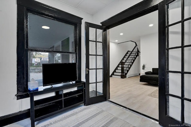 living room featuring french doors and wood-type flooring