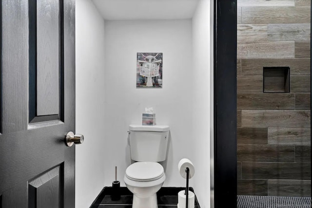 bathroom featuring tile patterned floors and toilet