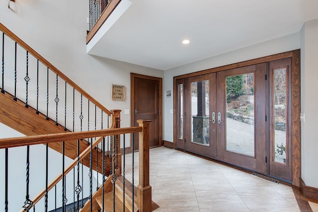 entrance foyer featuring french doors