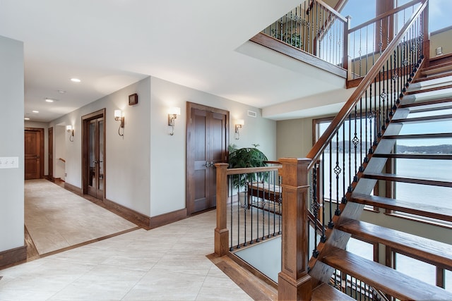 staircase featuring tile patterned floors