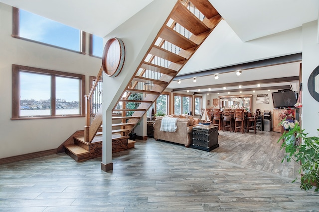 living room featuring bar area and wood-type flooring