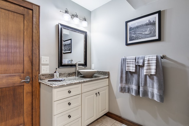 bathroom with tile patterned flooring and vanity