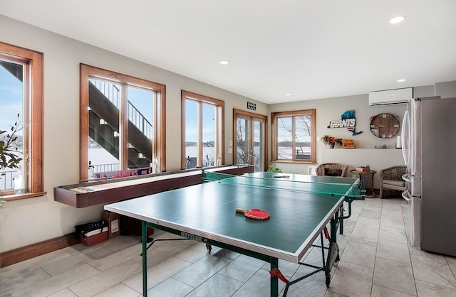 playroom with plenty of natural light and light tile patterned flooring