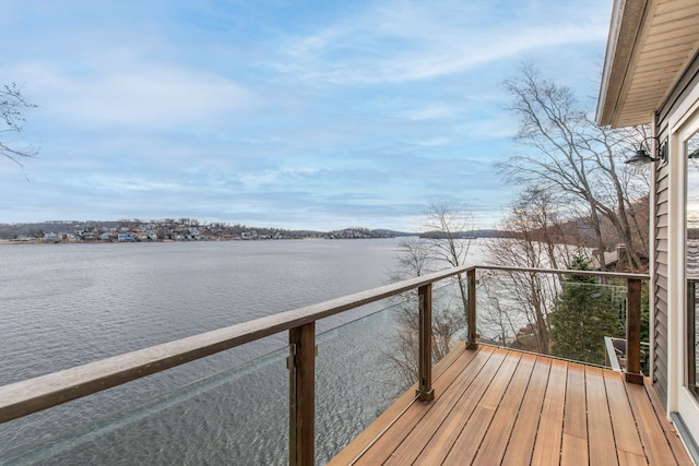 wooden deck featuring a water view