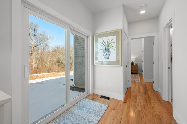 entryway with light hardwood / wood-style floors