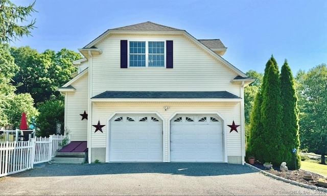 view of property exterior with a garage