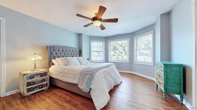 bedroom featuring wood-type flooring and ceiling fan