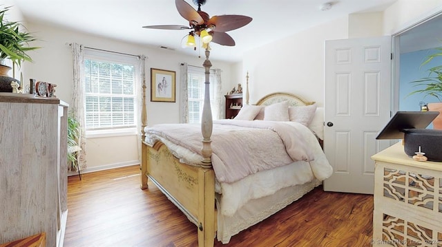 bedroom featuring ceiling fan and dark hardwood / wood-style floors