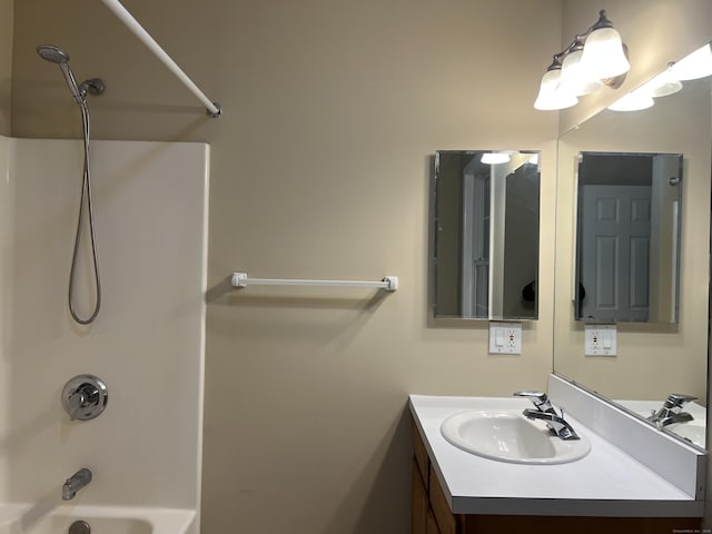 bathroom with bathtub / shower combination and vanity