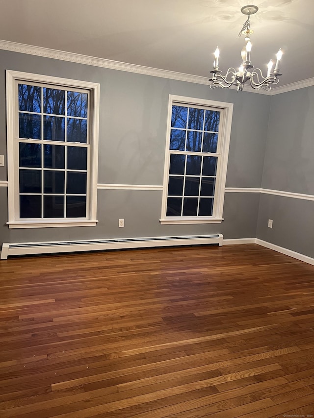 unfurnished room with ornamental molding, dark hardwood / wood-style flooring, baseboard heating, and a notable chandelier