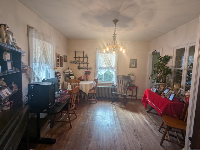 office space with a notable chandelier and hardwood / wood-style flooring