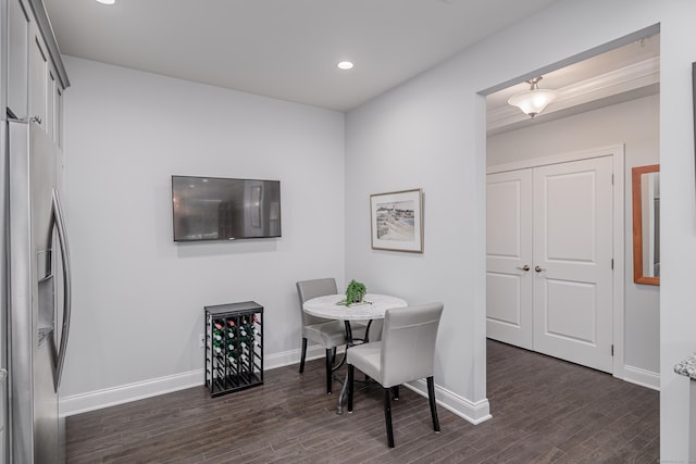 dining space featuring dark wood-type flooring